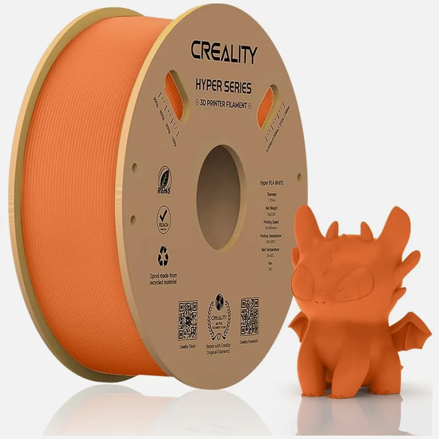A 1 kg spool of orange Creality Hyper Series PLA next to a printed dragon figure in the same colour.